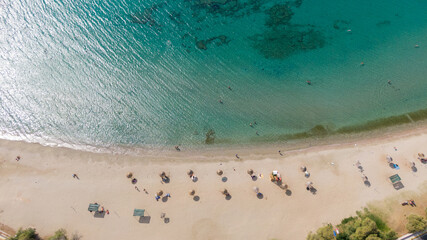Aerial view of turquoise clear water and sandy beach of Ireon or Limni Vouliagmeni Lake in Peloponnese, Greece 
