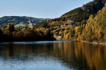 Fototapeta na wymiar Fishermen at the river Hallingdalselva. The river that run though Hallingdal, Norway. Fishing in the autumn.