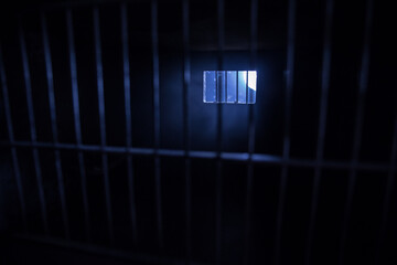 Jail or prison cell. Old grunge prison miniature. Dark prison interior creative decoration. Empty...