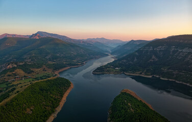 The river Arda valley in Rhodope mountains in Bulgaria during sunset. Meanders in the Lake Kardzhali or Kardjali