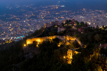 View from the height of the ancient fortress on the mountain in Alanya in Turkey in the evening illumination