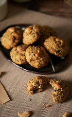 Oatmeal sesame cookies. Healthy homemade dessert decorated with sesame seeds. set on rustic wooden background.