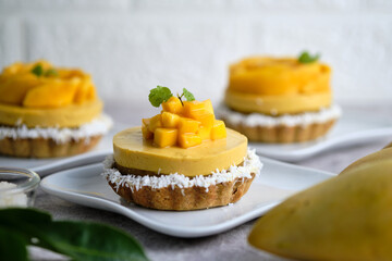 Mango Mousse tart with sticky rice and fresh mango.
