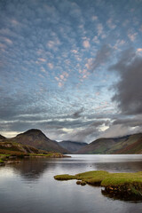 Fototapeta na wymiar Beautiful late Summer landscape image of Wasdale Valley in Lake District, looking towards Scafell Pike, Great Gable and Kirk Fell mountain range
