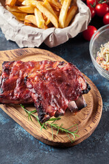 Spicy barbecued pork ribs served with BBQ sauce
