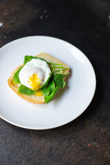 tasty poached egg sandwich
spinach on the table serving portion size top view place copy space for text food background rustic