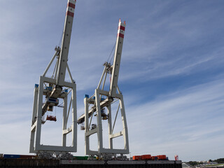 in port there are cranes for loading and unloading ships