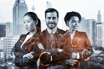 Fototapeta na wymiar Group of business colleagues working on technology at business process to achieve tremendous growth in commerce. Worldwide process to conduct transactions. Tech hologram icons over Kuala Lumpur