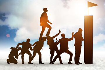 Career progression concept with businessman climbing stairs