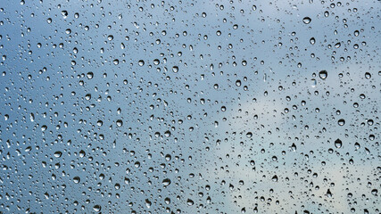 raindrops on macro glass against the sky