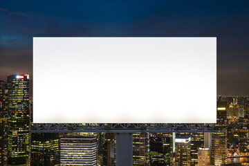 Obraz premium Blank white road billboard with Singapore cityscape background at night time. Street advertising poster, mock up, 3D rendering. Front view. The concept of marketing communication to sell idea.