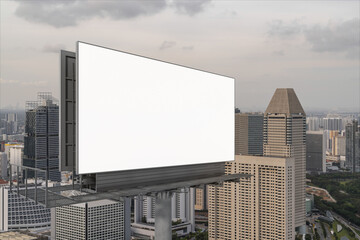 Obraz premium Blank white road billboard with Singapore cityscape background at sunset. Street advertising poster, mock up, 3D rendering. Side view. The concept of marketing communication to sell idea.