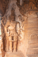 badami cave sculptures of hindu gods carved on walls ancient stone art in details