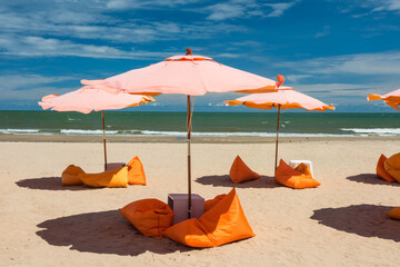 summer beach with orange relax seat and parasol © Blanscape