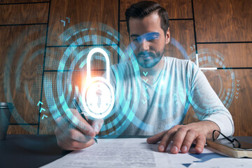 Handsome man working on Data protection project. Multiexposure. Lock icon hologram.