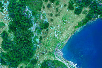 Beautiful mystical  alpine lake, amazing mountain aerial view from above.

