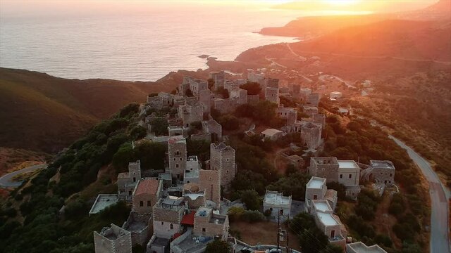 Amazing view over Vathia village against a dramatic sunset sky. Vathia, Mani, Laconia, Peloponnese, Greece