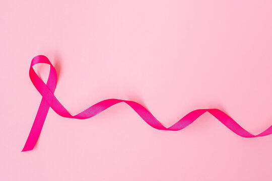 October Breast Cancer Awareness month, Pink Ribbon on pink background for supporting people living and illness. International Women, Mother and World cancer day concept