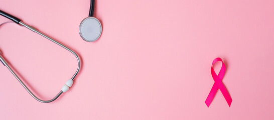 Breast Cancer Awareness, Pink Ribbon with Stethoscope on pink background for supporting people living and illness. Woman Healthcare and World cancer day concept