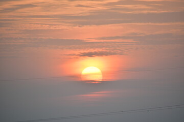 Vintage image of sunset sky with dark dramatic clouds.