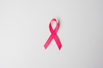 October Breast Cancer Awareness month, Pink Ribbon on grey background for supporting people living...