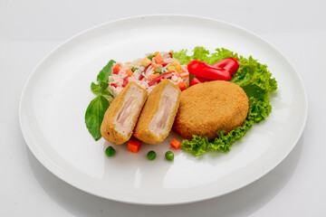 Chicken meatballs in batter with ham and risotto