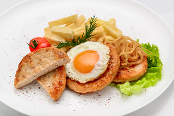 Beef rissole, juicy beef steak with egg and potatoes