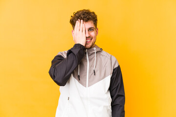 Fototapeta premium having fun covering half of face with palm.