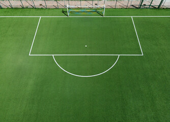 Aerial view of an empty green soccer field