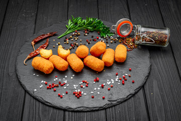 Fried mozzarella, cheddar cheese bites, balls with ketchup
