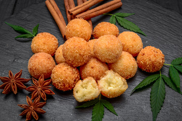 fried cheese ball on a wooden plate