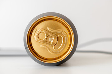 Golden top of a can of beer.