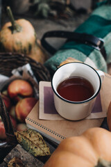 Fall styled composition. Autumn breakfast still life. Scandinavian hygge concept. Morning concept. Cozy autumn scene with pumpkins and apples. Flat lay. Home decor. Thanksgiving and Halloween concept.