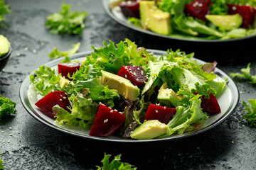 Vegetarian avocado and beet salad in plate. Healthy vegan food