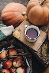 Fall styled composition. Autumn breakfast still life. Scandinavian hygge concept. Morning concept. Cozy autumn scene with pumpkins and apples. Flat lay. Home decor. Thanksgiving and Halloween concept.