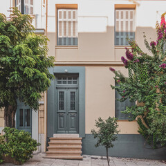 Fototapeta na wymiar classic design house front by the sidewalk, Athens Greece