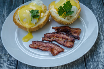 Homemade Benedict Eggs on the plate with souce