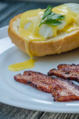 Homemade Benedict Eggs on the plate with souce