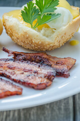 Homemade Benedict Eggs on the plate with souce