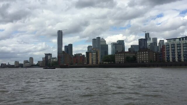 Canary Wharf, London, UK,  business district of London viewed from river - stock footage 