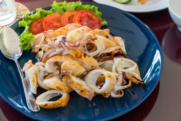 Grilled squid and vegetable on plate,Grilled squid on dish wooden table