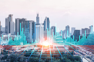 Forex and stock market chart hologram over panorama city view of Kuala Lumpur. KL is the financial center in Malaysia, Asia. The concept of international trading. Double exposure.