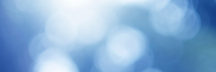 Light blue Leaf background. Blurred leaves and circular bokeh. Abstract for design and wallpaper.