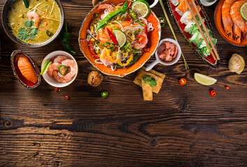 Asian food background with various ingredients on rustic wooden background , top view. Vietnam or Thai cuisine.