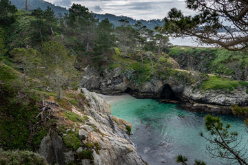 China Cove, as viewed from the hiking trails on cliffs above, at Point Lobos State Natural Reserve, a popular tourist destination in Carmel by the Sea, along the central pacific coast of California. 