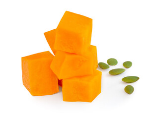Pumpkin pieces with  seeds  isolated on white background. Diced Pumpkin, close up..