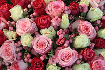 Pink and purple roses in a big wedding centerpiece