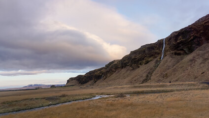 Fototapeta na wymiar Landscape with a little waterfall in Iceland