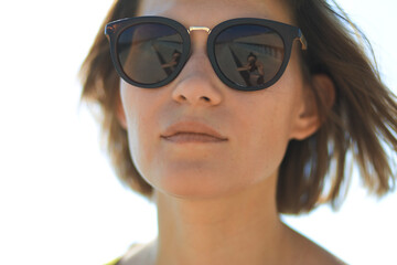 Portrait of a brunette girl in sunglasses