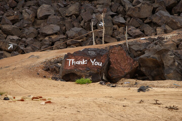 on the rock stone is written thank you